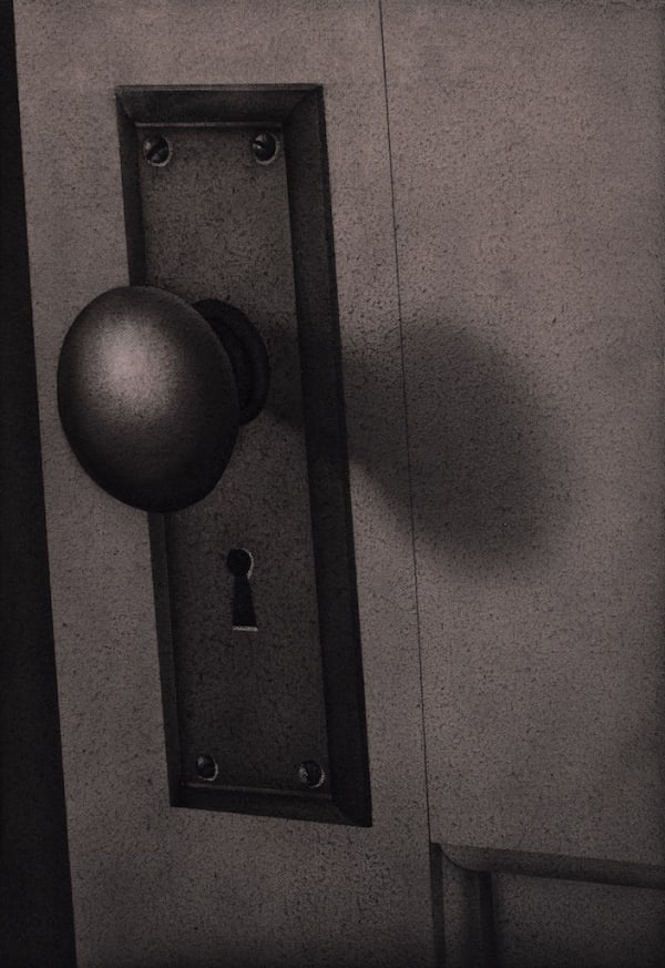 black and white painting of a close of of a door knob