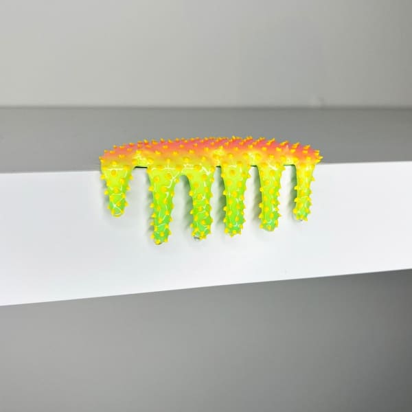 blob sculpture in yellow and green