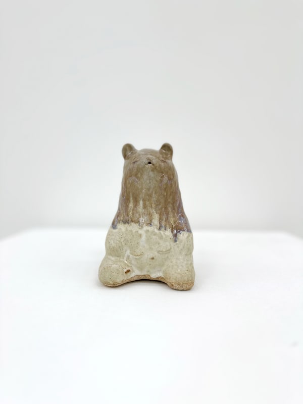 Ceramic sculpture of a bear sitting