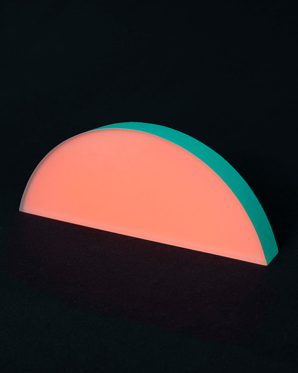 Rachel Strum - epoxy neon sculpture of horizontal strip of a round panel top edge - orange and Turkish green.