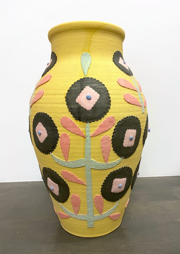 Heidi Anderson yellow clay vessel with black flowers accented with pink and green stems