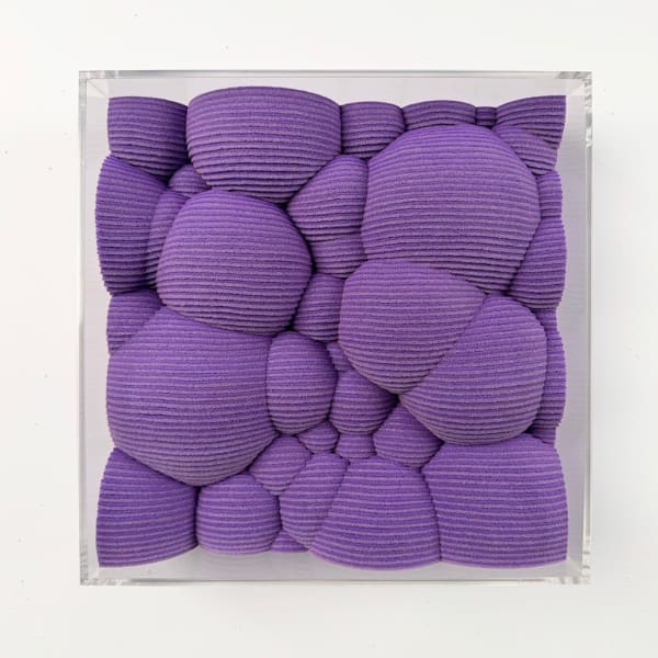 Textured purple square made from felt with a clear acrylic frame