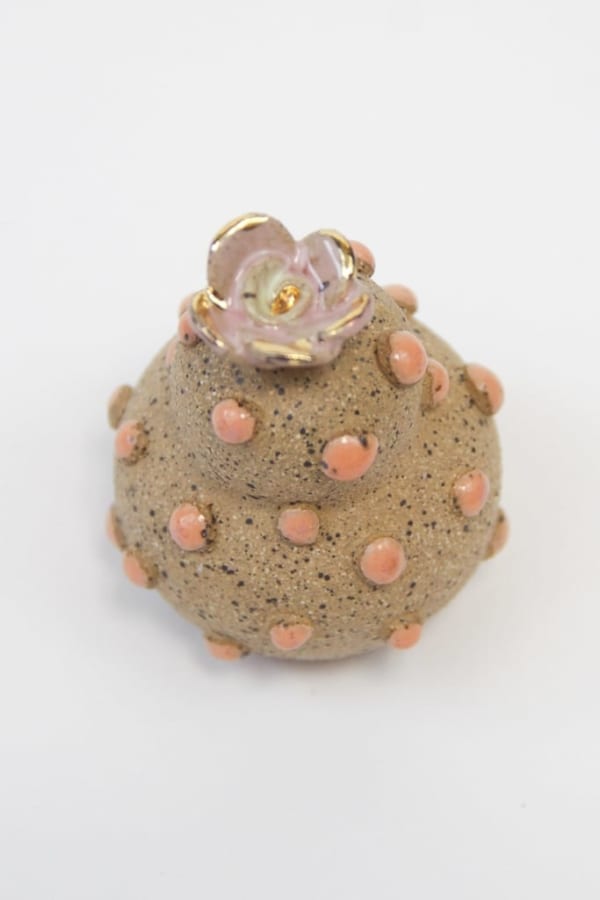 Jen Dwyer brown sculpture of abstract plant covered in pink dots with pink flower on top