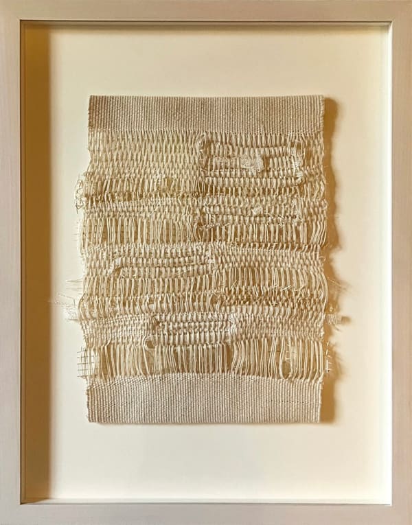 Beige woven rectangle in a frame