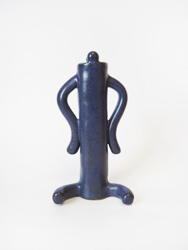 ceramic piece by Jocelyn Tsaih of a tall deep purple figure sitting