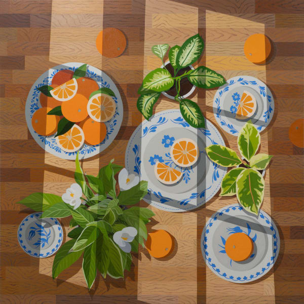 Natalia Juncadella painting of oranges on white plates with blue flowers, green plants with white flowers on wooden tabletop. Shadows from windowpanes overlaid