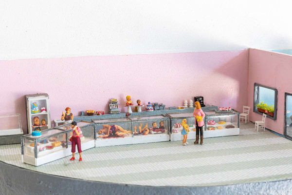 miniature diorama by Abigail Goldman of human body parts in bakery shop cases