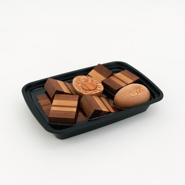 Lap Ngo - Thit Kho made from wood in a takeout container