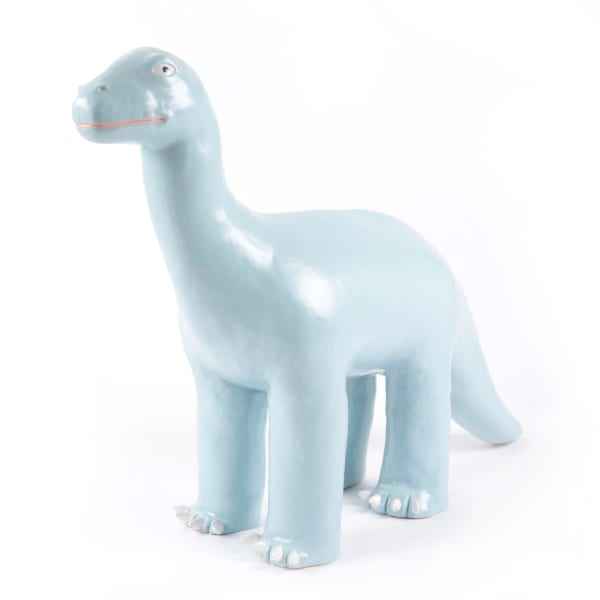 light blue ceramic sculpture of a long neck dinosaur standing