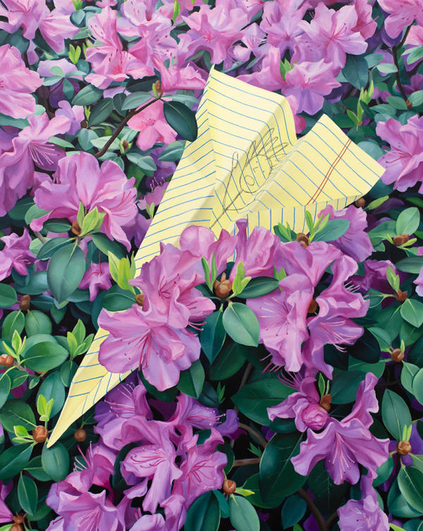 a paper airplane made of yellow lined paper with a doodle on it resting in a bed of purple flowers