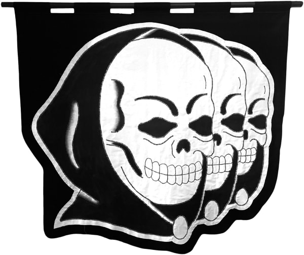embroidered black and white banner showing three hooded skulls in a row