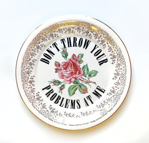 Plate reading "Don't Throw Your Problems At Me"