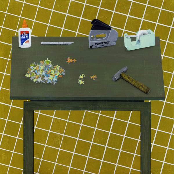 Gabe Langholtz of puzzle, glue, hammer, stapler and tape on tabletop with yellow checkered background