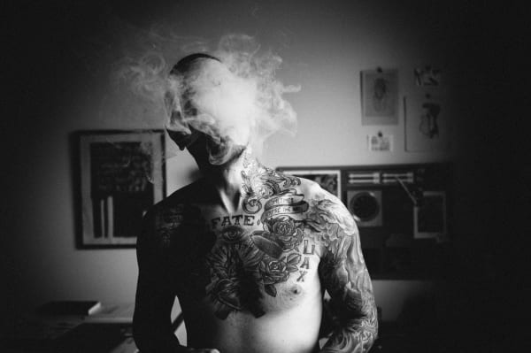 Shaun Roberts photo shirtless tattooed man blowing smoke