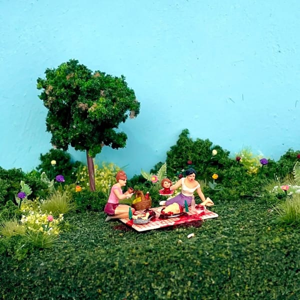 two women in a park having a picnic consisting of human remains