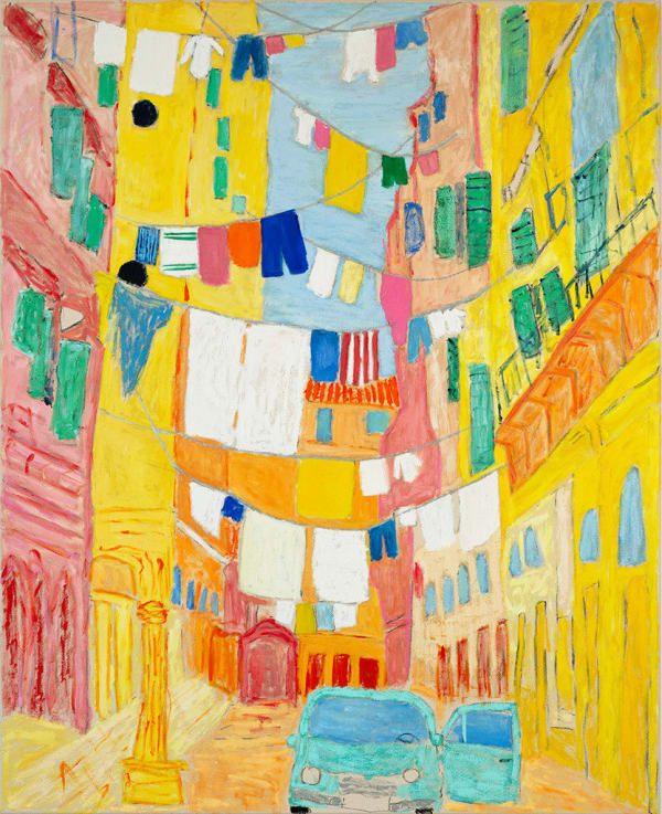 brightly colored alleyway with ropes of drying clothes tied across