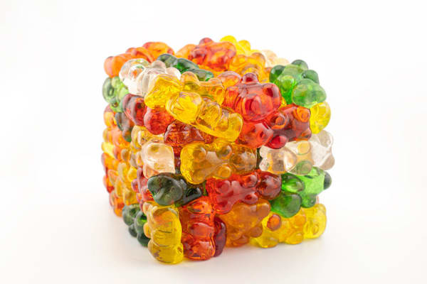 Glass sculpture of gummy bears stacked into a cube
