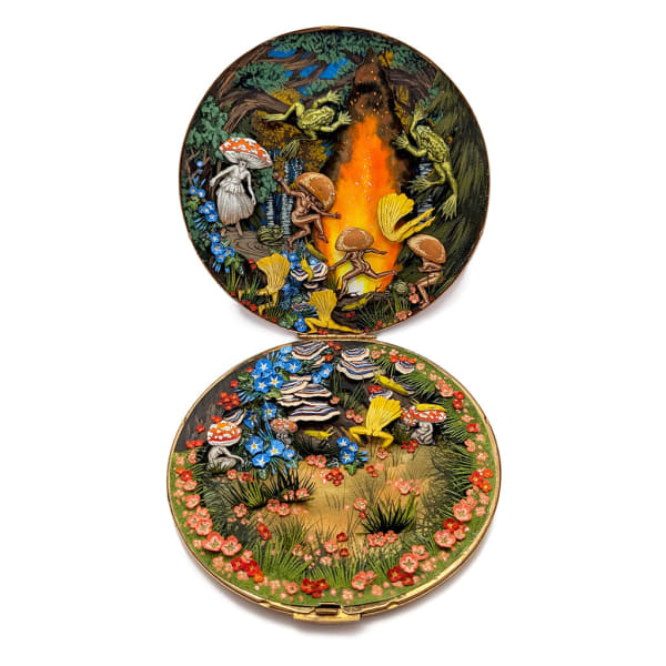 hand-cut watercolor collage in antique cosmetic compact by Shannon Taylor of mystical creatures dancing around a fire in the woods