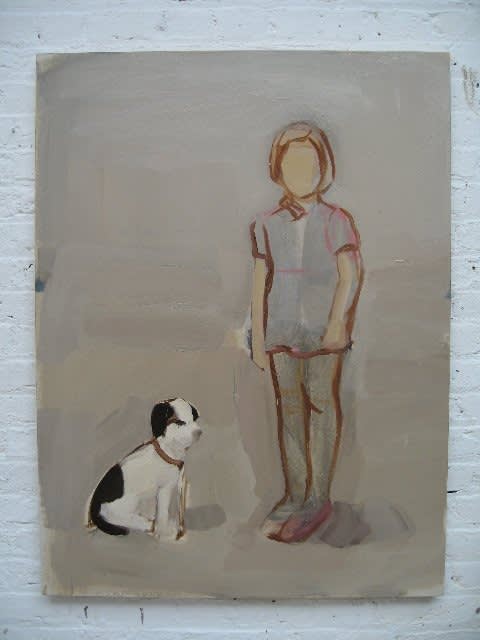 Faceless girl stands to the right of seated black and white dog in front of plain gray background.