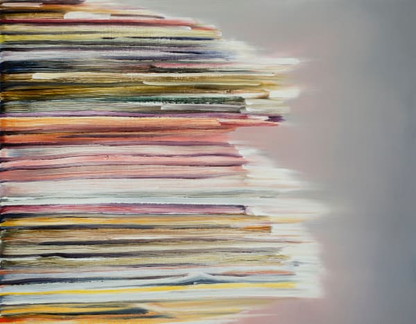 Blurred stack of colorful sheets of paper emerging from the left side of the canvas.