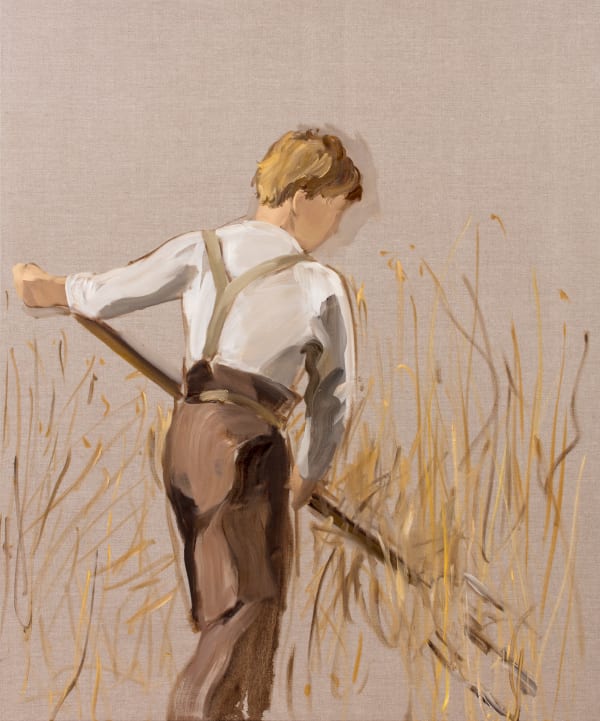 Young faceless boy viewed from the back wields pitchfork in field of hay.