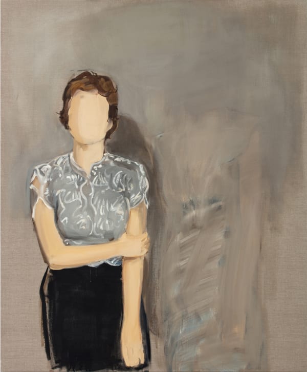 Faceless woman stands to the left of the composition against brown background. She is wearing a gray and white blouse with a black skirt and is holding her left arm with her right hand.