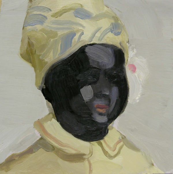 Female Black doll with yellow head scarf and shirt in front of plain gray background.