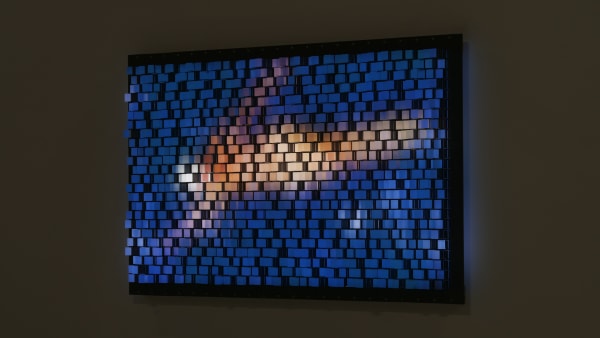 Still image of installation angled view of Vertical Repixelated