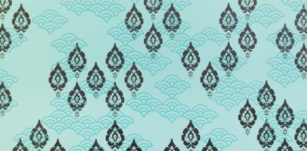 Silkscreen layers of black and blue acrylic paint create stereotypical japanese motifs patterns on aqua painted panel