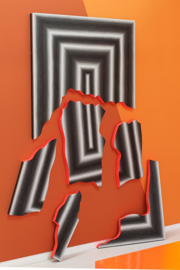 A slab painted in black and white concentric rectangles is broken into shards. The insides of the shards are painted in neon red. The shards are set against a two-tone orange background.