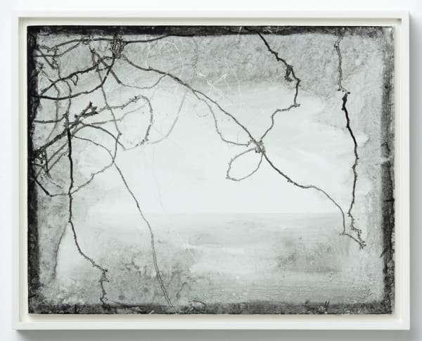 Gray horizontal faded ink stains with overlapping dark ink trails bordered by a dark ink wash. Upper left corner has a heavier concentration of ink trails