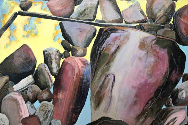 An image of many boudlers and rockers balancing on each other with a yellowish backfround.