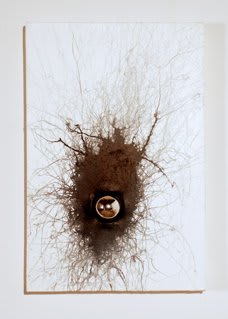 Mixed media piece with found object inserted towards the bottom center of the white painted canvas creating a recession into depth Brown ink is hastily applied around the indent along with brown thread which is pasted onto the surface of the canvas