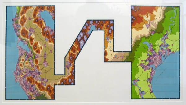 A large light gray space is geometrically “cutaway” to reveal several earth-toned shapes that form a topographic view of a large water surrounded land mass In some areas the piece is inked in a light purple and is filled with a webbing of thin lines alluding to populous cities and towns
