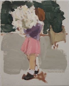 Young girl wearing pink skirt and purple blouse holds large bouquet obscuring her face as she walks to the left in profile view.