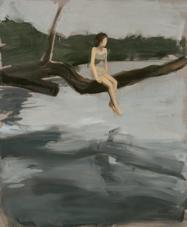 Faceless woman sits on tree branch overhanging open water in front of a forest in the background.