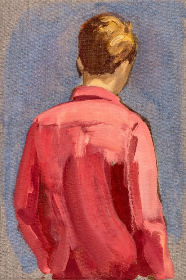 Blonde boy in red shirt with hand in pocket faces away from viewer in front of blue and exposed canvas background. His legs are cropped out of the composition.