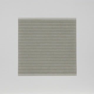 Against white background, thin beige horizontal lines cut across green square-shaped color field.