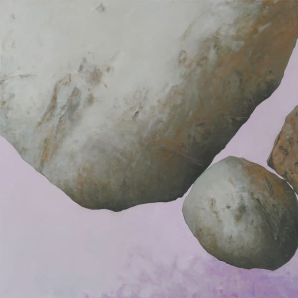 Three boulders balancing on each other with purple background.