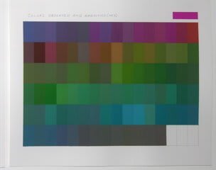 Dark color block grid made up of several shades of green blue purple red and brown