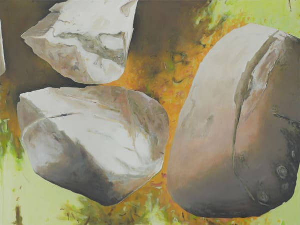 An image of painted boulders and rocks with an orange yellow background.