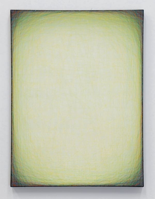 Layers of multi-colored threads strung across a rectangular wooden and plaster panel create the effect of a large light green glowing center that is enclosed by a thin dark green border