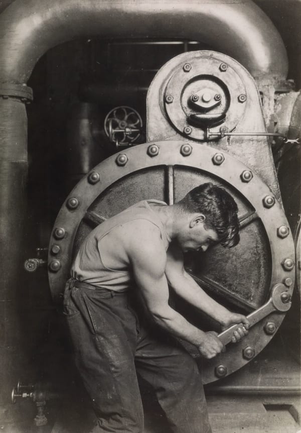 Lewis Hine Powerhouse Mechanic at machine with wrench