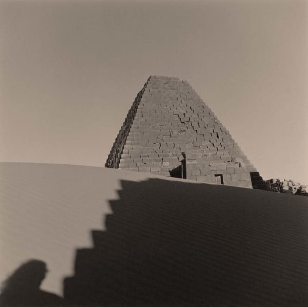 Lynn Davis photograph of pyramid in Meroe, Sudan with shadow and self-portrait silhouette