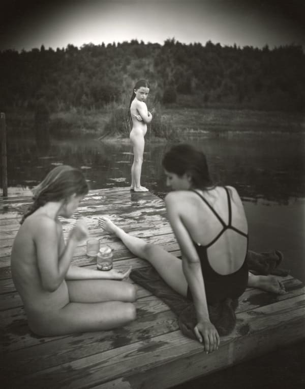 Virginia at the end of the dock looking at the big girls jealously, from the Immediate Family series by Sally Mann