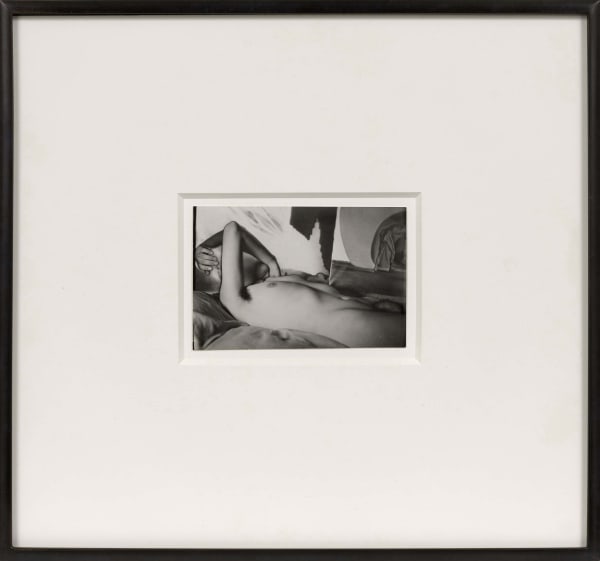 Man Ray nude portrait of Meret Oppenheim reclining nude on a bed, with surreal shadows and abstract forms in the background