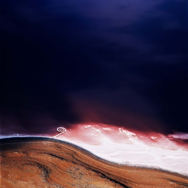 distant aerial view of Robert Smithson's Spiral Jetty in Great Salt Lake, by David Maisel