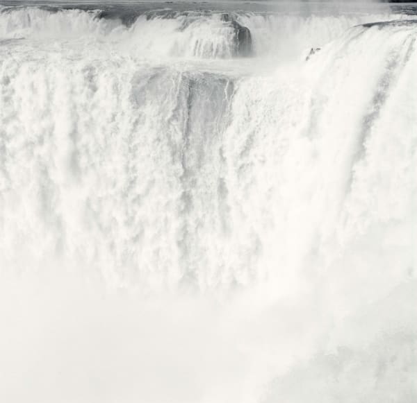 Lynn Davis photograph of Iguazu Falls, Argentina, waterfall rushing over cliff into white mist