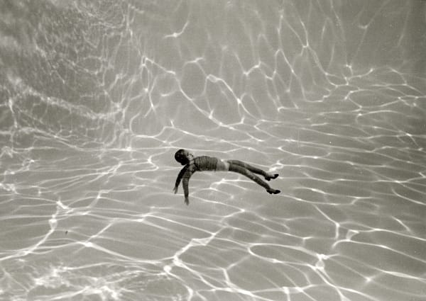 Laurie Simmons Woman/Heels floating on back