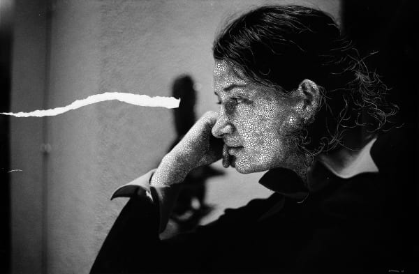 Sebastiaan Bremer Veronica Listen black and white image of woman with hand on chin with painted dots and ripped paper